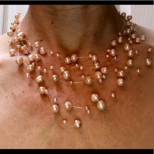 Pink pearl necklace and earrings